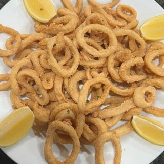 Fried Calamari served on side Sauce